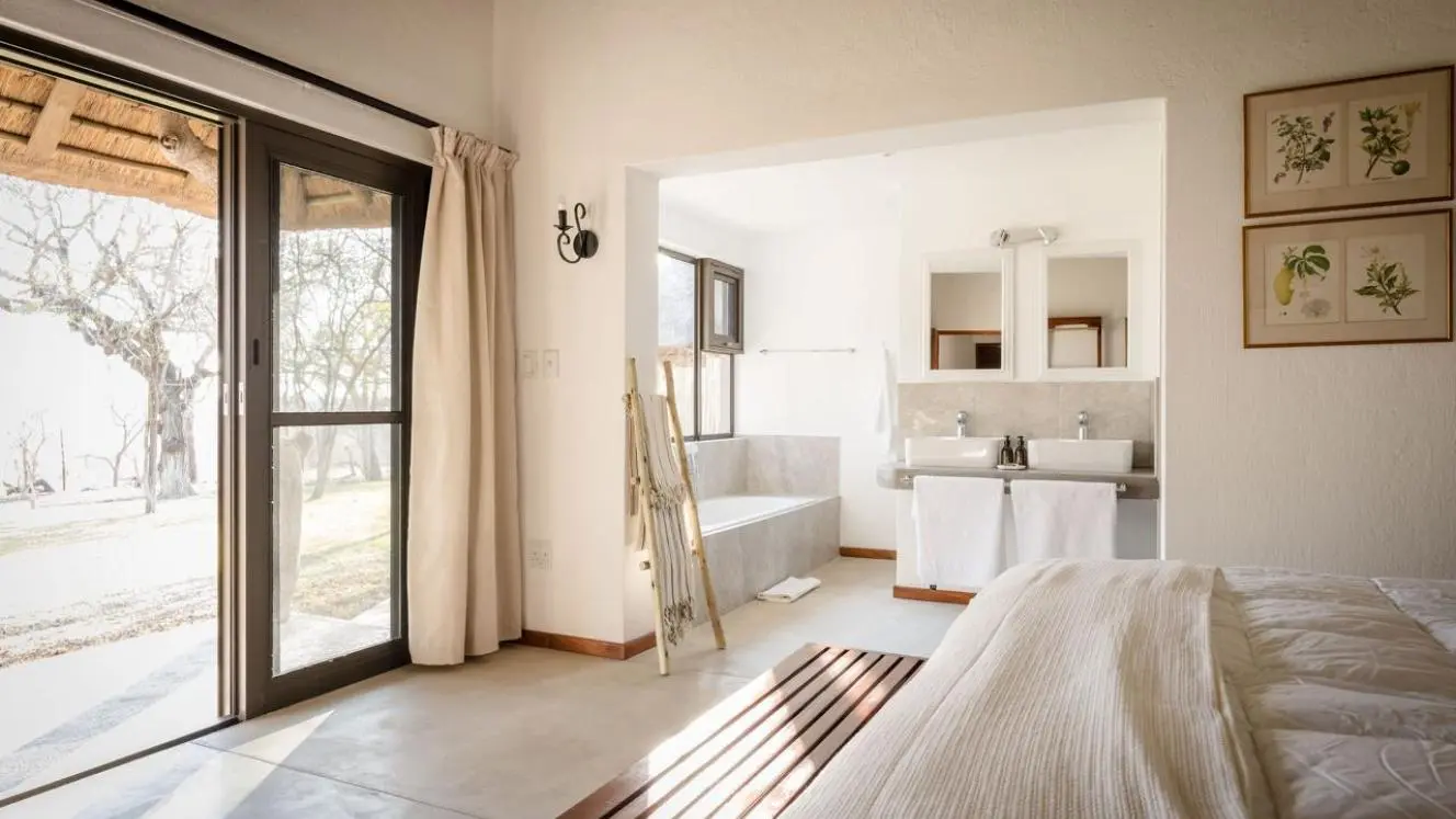 Light-filled guest room at Chimani Bush Camp