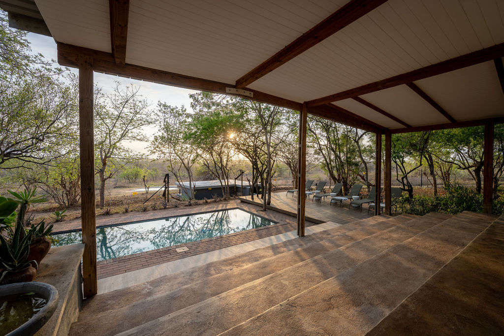 Pool and broad covered deck at Tumbeta House